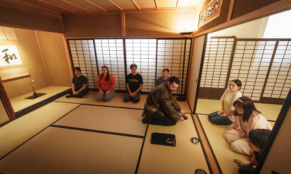 Students participate in a traditional tea ceremony