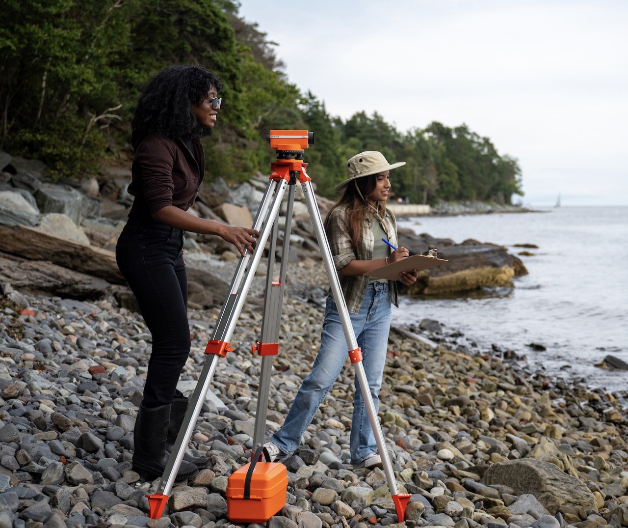 students surveying on the beach