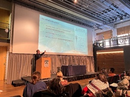 photo of Dr. Jonathan Fowler giving a talk