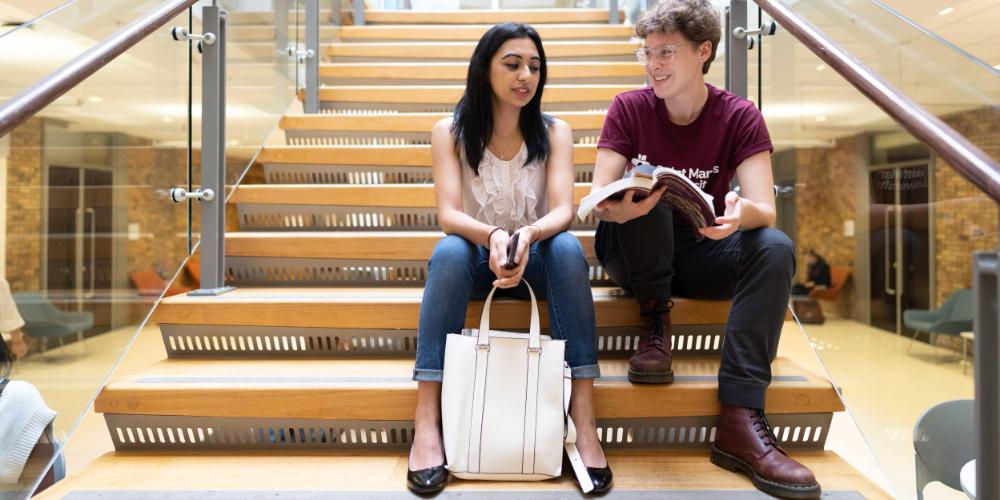 Students sitting on stairs.